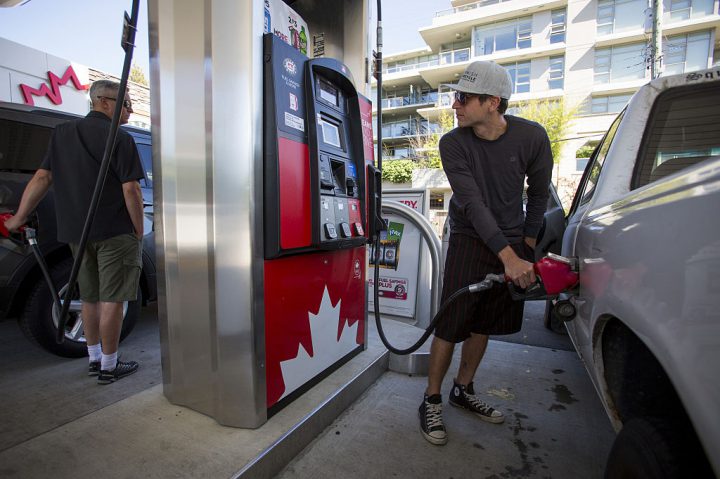 A file photo of a B.C. man filling his car with fuel at a gas station.