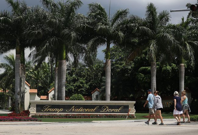 A sign reading Trump National Doral is seen on the grounds of the golf course owned by President Donald Trump on June 1, 2016 in Doral, Florida.  