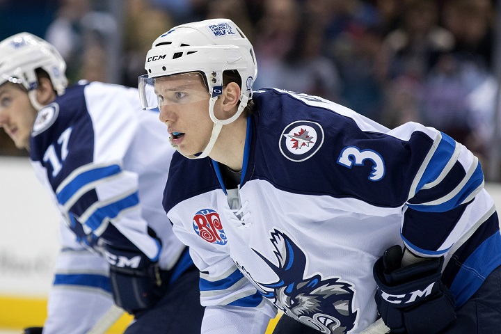 Jan Kostalek readies for a faceoff during the second period of an AHL game between the Manitoba Moose and Cleveland Monsters on Feb. 10, 2017.