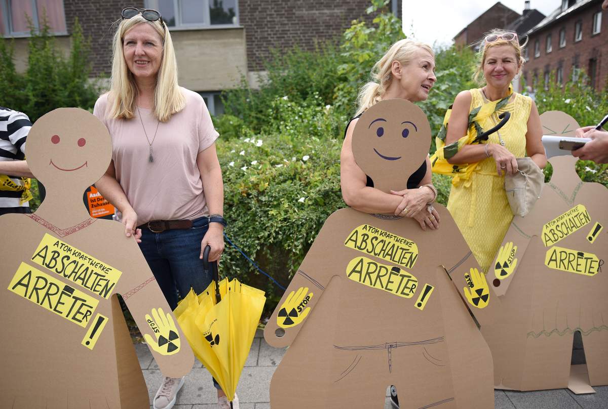 Participants of the anti-nuclear “Chain Reaction” demonstration build a human chain to protest against the operation of Belgium’s Tihange 2 and the Netherland’s Doel 3 nuclear power plants on June 25, 2017 in Aachen, western Germany,