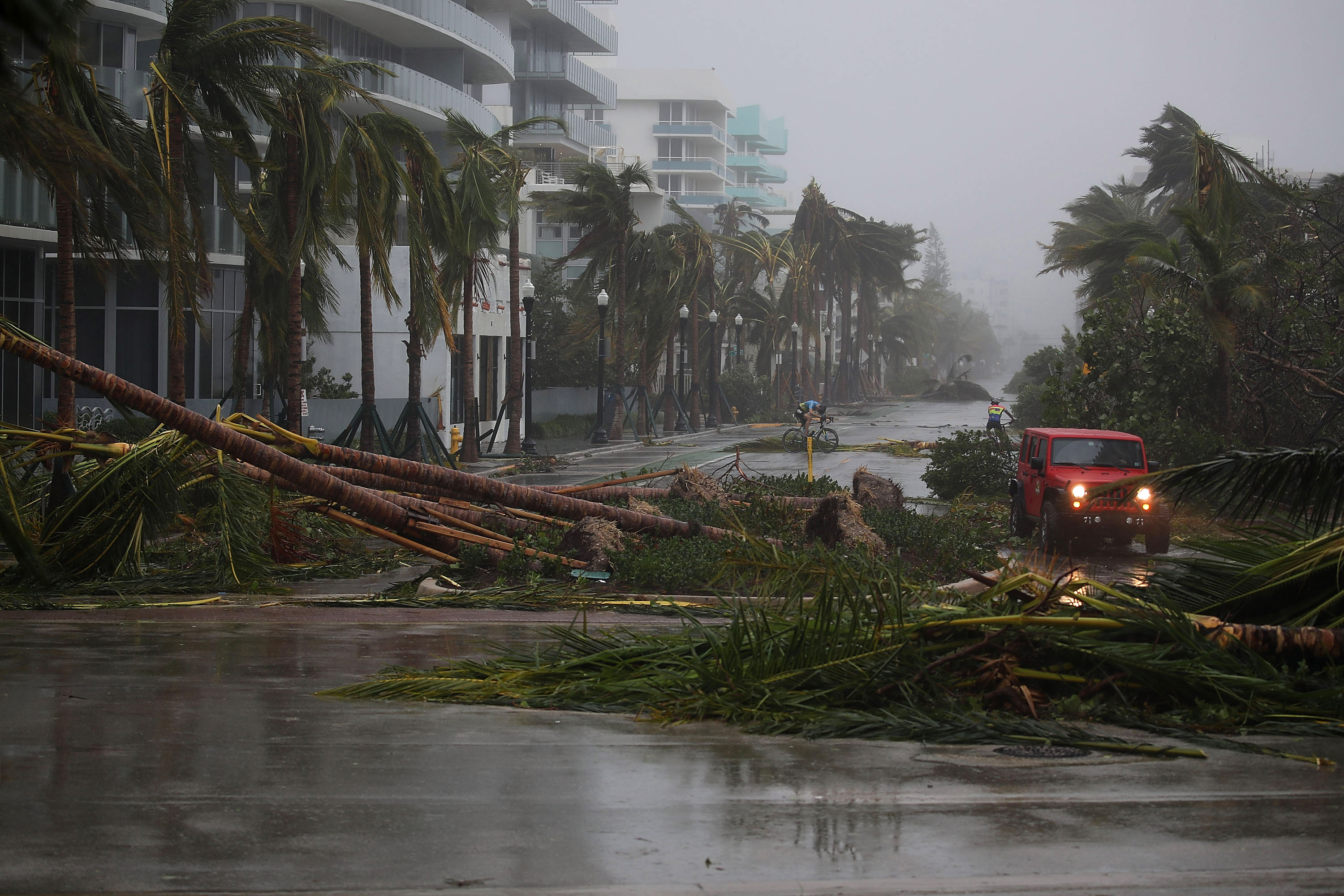 Irma weakens to tropical storm, still lashes Florida with wind and