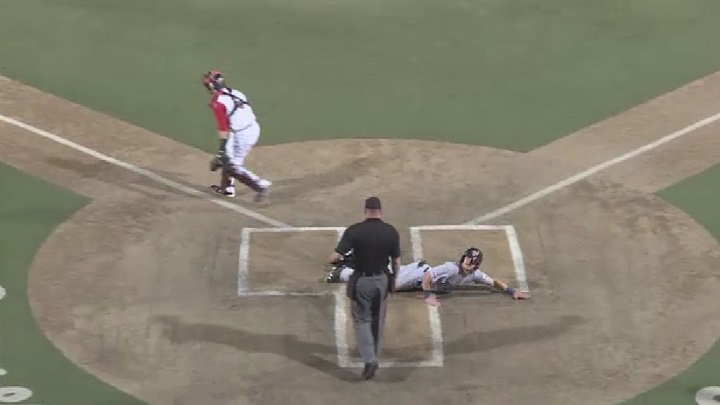 Winnipeg Goldeyes outfielder Josh Romanski slides in safely in game one of the American Association championship series against the Wichita Wingnuts.