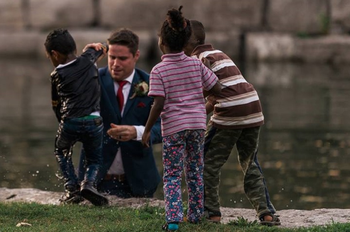 Photographer Darren Hatt captured photos of a groom pulling a boy from a river in Kitchener.