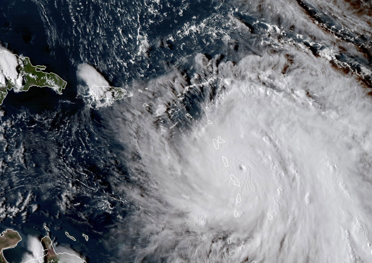 This Monday, Sept. 18, 2017, GOES East satellite image provided by NASA taken at 20:30 UTC, shows the eye of Hurricane Maria as it nears Dominica.