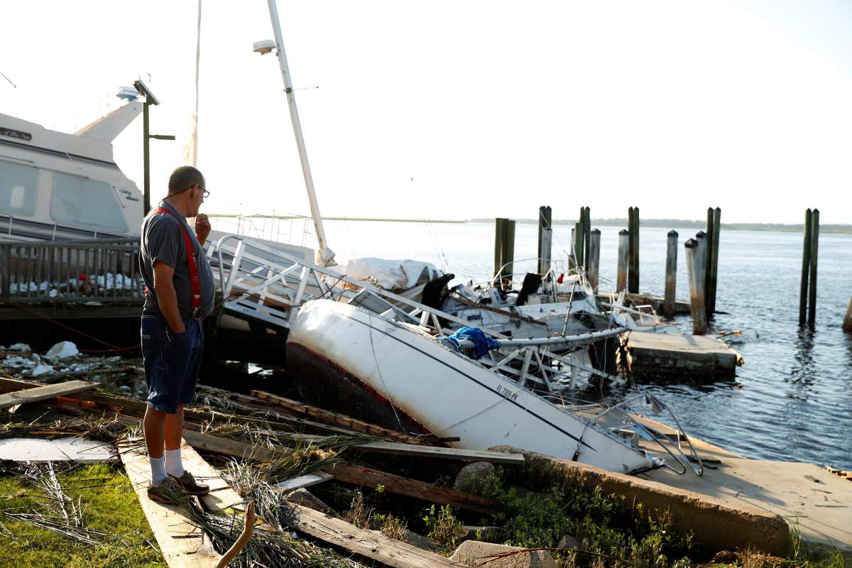 A resident surveys the damage to the marina after Hurricane Irma passed through in St Marys, Georgia, U.S., September 12, 2017.