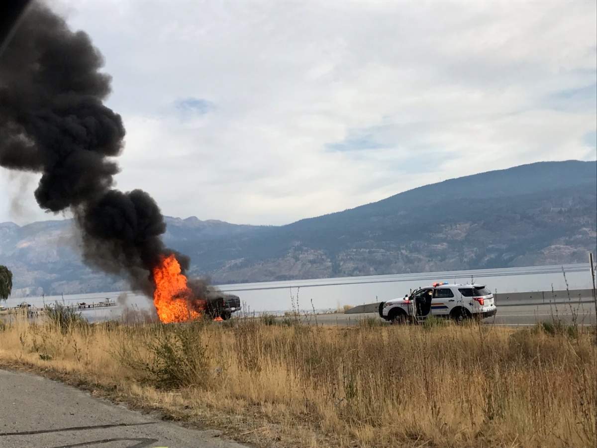 Fire destroys a pickup truck Tuesday on Highway 97 near Summerland.