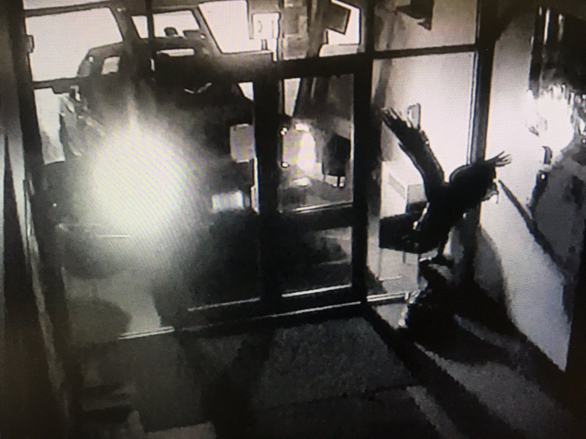A still from surveillance video of a truck ramming through the clubhouse doors at the Wabasca golf course during an ATM theft.