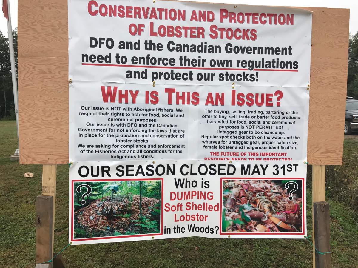 Signs posted by Nova Scotia fisherman outside the federal Fisheries office.