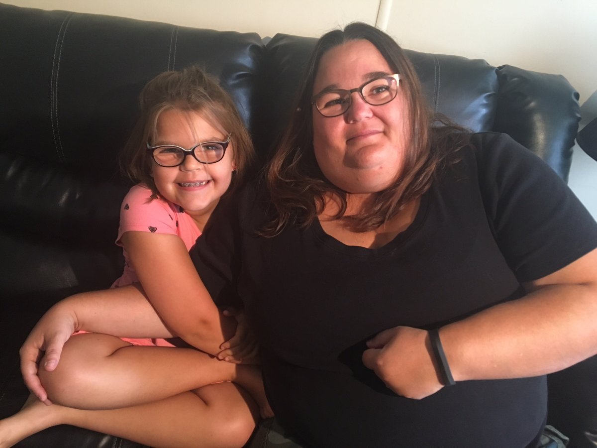 Tracy LaPointe poses with her nine-year-old daughter Anaya.