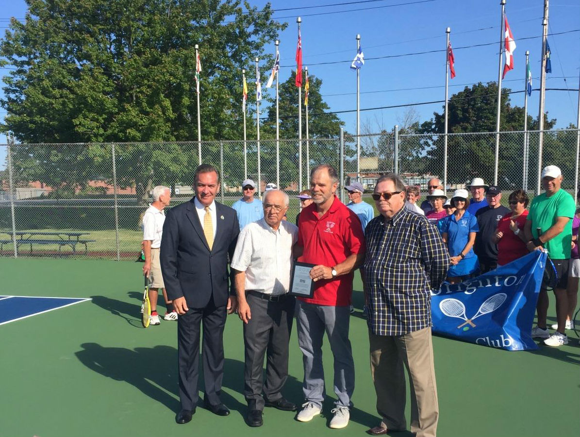 Mayor Mark Walas, left, MPP Lou Rinaldi,and Brighton Tennis Courts president Karl Dyer receive funding from Ontario Trillium Foundation representative Jamie Simmons, right.