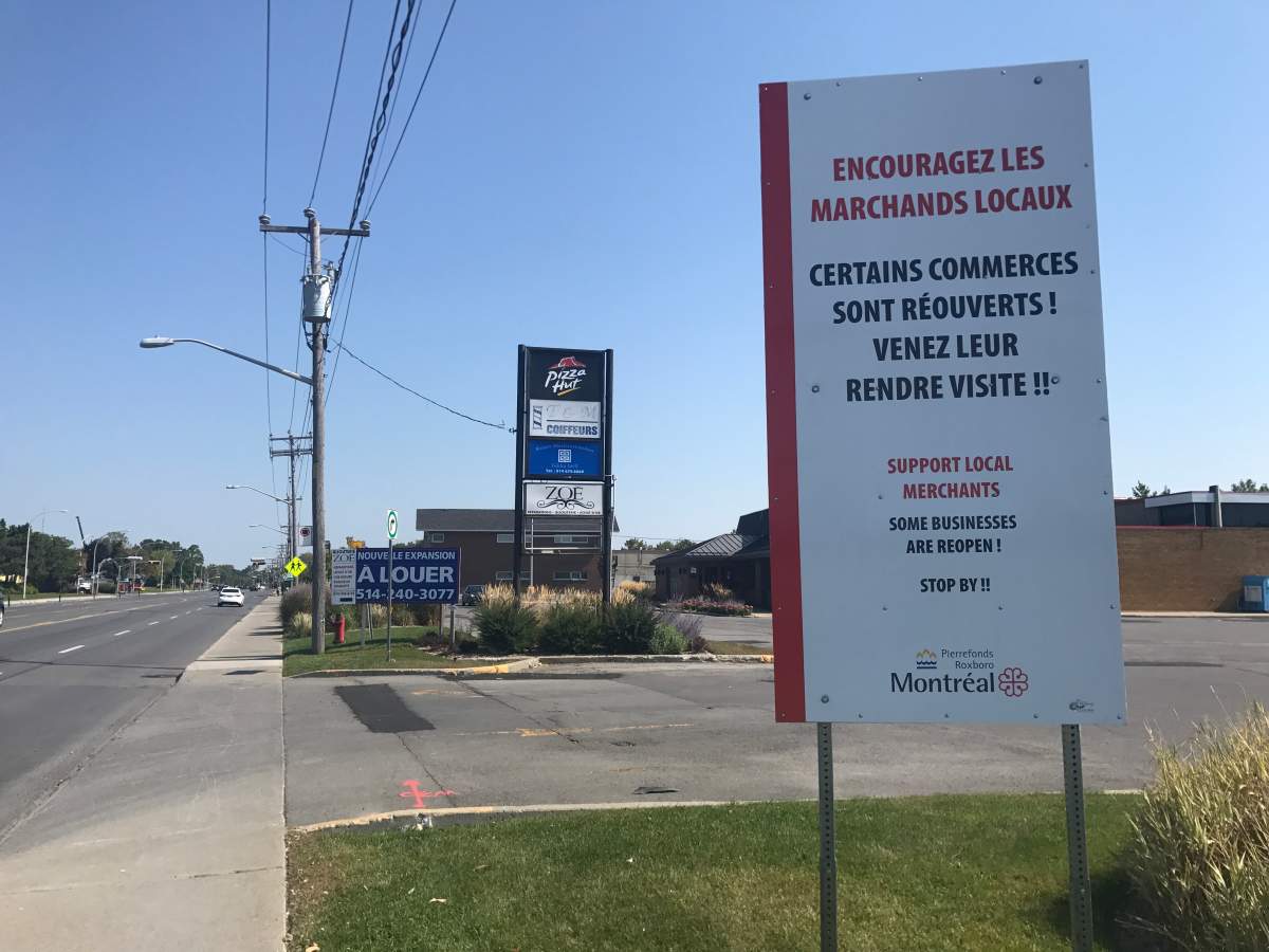 A sign installed on Pierrefonds Boulevard, stating that businesses are open, Wednesday, Sept. 13, 2017.