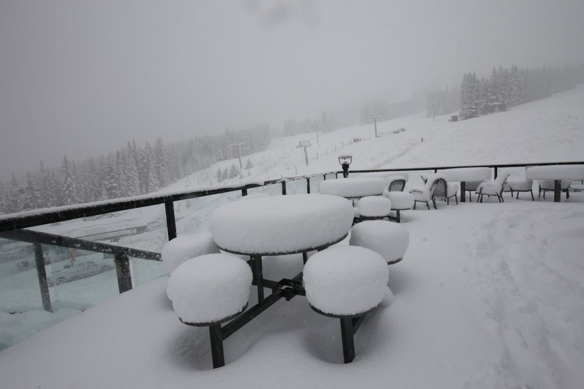 Snow accumulates on the tables outside the chalet at Marmot Basin.
