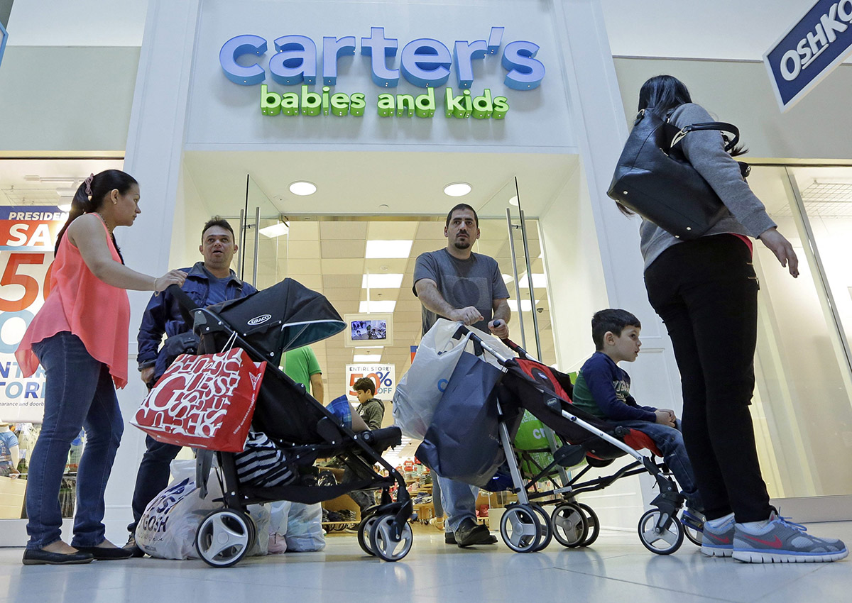 In this Tuesday, Feb. 9, 2016, file photo, people shop in Miami. After years of sluggish growth, typical U.S. household incomes finally topped pre-recession levels in 2016 and reached an all-time high, according to information released by the Census Bureau, Tuesday, Sept. 12, 2017.