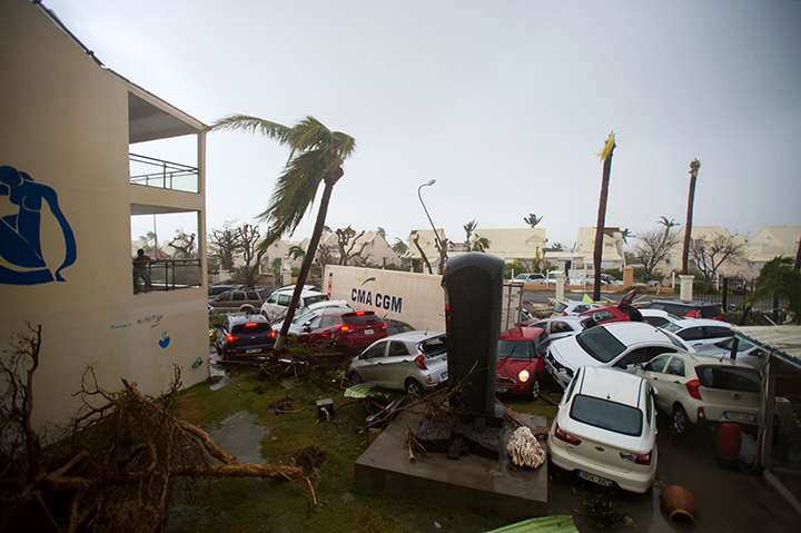 A photo taken on September 6, 2017 shows cars piled outside a hotel on the French side of Saint Martin, after the passage of Hurricane Irma.
