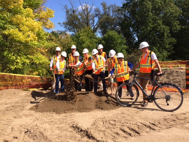 City politicians break ground as construction begins on the last remaining gap in the Kiwanis Park recreational pathway system.
