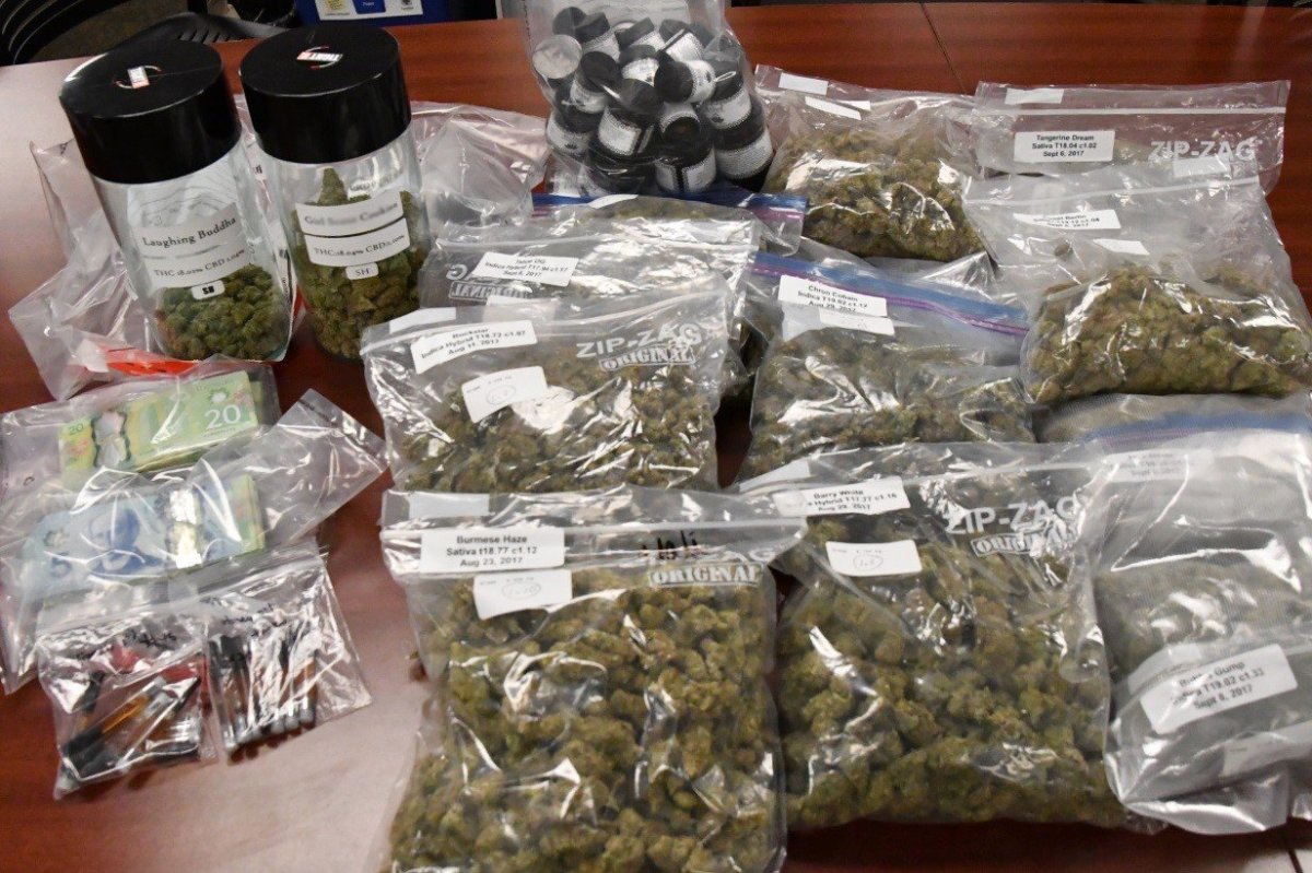 London Police display drugs and cash seized during raid at marijuana dispensary Wednesday Sept. 20.