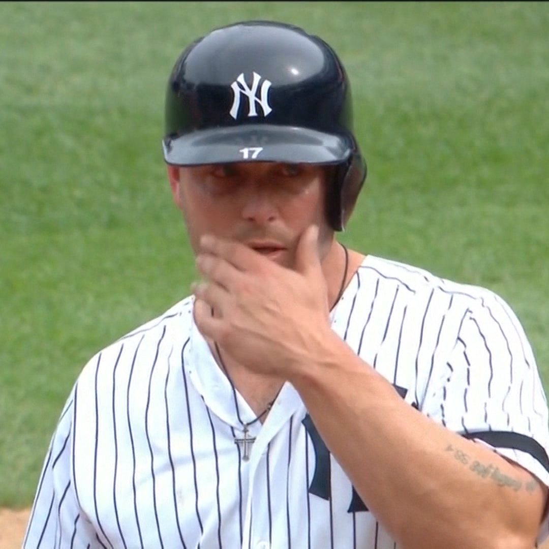 New York Yankees outfielder Matt Holliday wipes away tears after witnessing a young girl be struck in the face by a foul ball on Sept. 20.