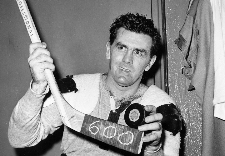 In this Nov. 26, 1958, file photo, Montreal Canadiens' Maurice (Rocket) Richard poses with his hockey stick marked 600 and a puck after scoring his 600th career goal in an NHL hockey game against New York Rangers in New York. It's not as if any great injustice was done, but Montreal Canadiens legend Maurice (Rocket) Richard is getting an assist added to his prodigious NHL scoring totals. Sunday, Sept. 24, 2017.
