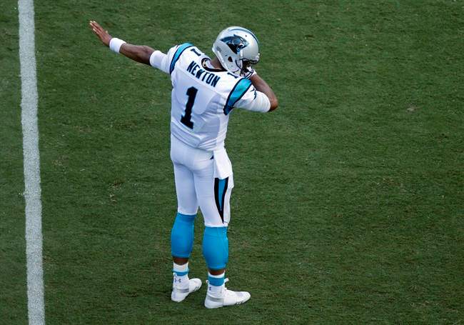 Carolina Panthers QB Cam Newton (1) 'dabs' after running for a first down against the Buffalo Bills in Charlotte, N.C., Sunday, Sept. 17, 2017.