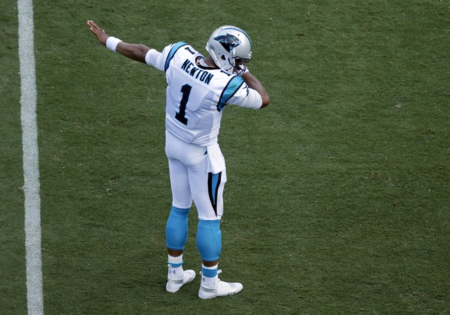 Carolina Panthers QB Cam Newton (1) 'dabs' after running for a first down against the Buffalo Bills in Charlotte, N.C., Sunday, Sept. 17, 2017.