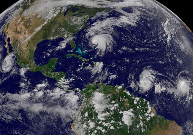 This image made available by the NOAA-NASA GOES Project shows tropical weather systems Hurricane Norma, left, on the Pacific Ocean side of Mexico; Jose, center, east of Florida; Tropical Depression 15, second from right, north of South America, and Tropical Storm Lee, right, north of eastern Brazil, on Saturday, Sept. 16, 2017 at 2:45 p.m. EDT.