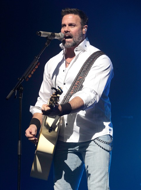 In this Jan. 17, 2013 file photo, Troy Gentry of the Country Music duo Montgomery Gentry performs on the Rebels On The Run Tour in Lancaster, Pa.
