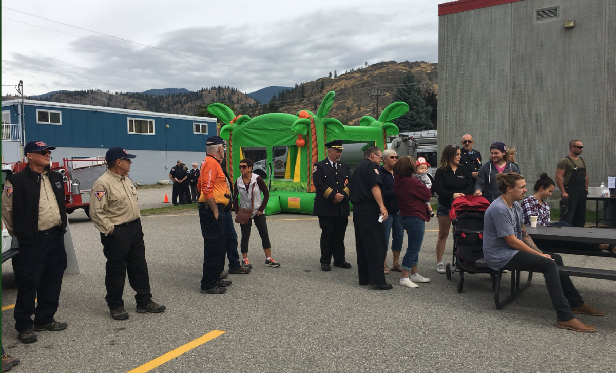 Dozens of people gathered at the Okanagan Falls Fire Dept. Sunday Sept. 24 for an open house and charity fundraiser .