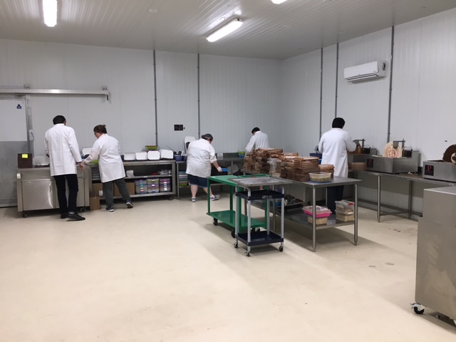 Workers at the Peace by Chocolate factory assemble the goods that have made the Hadhads a success story