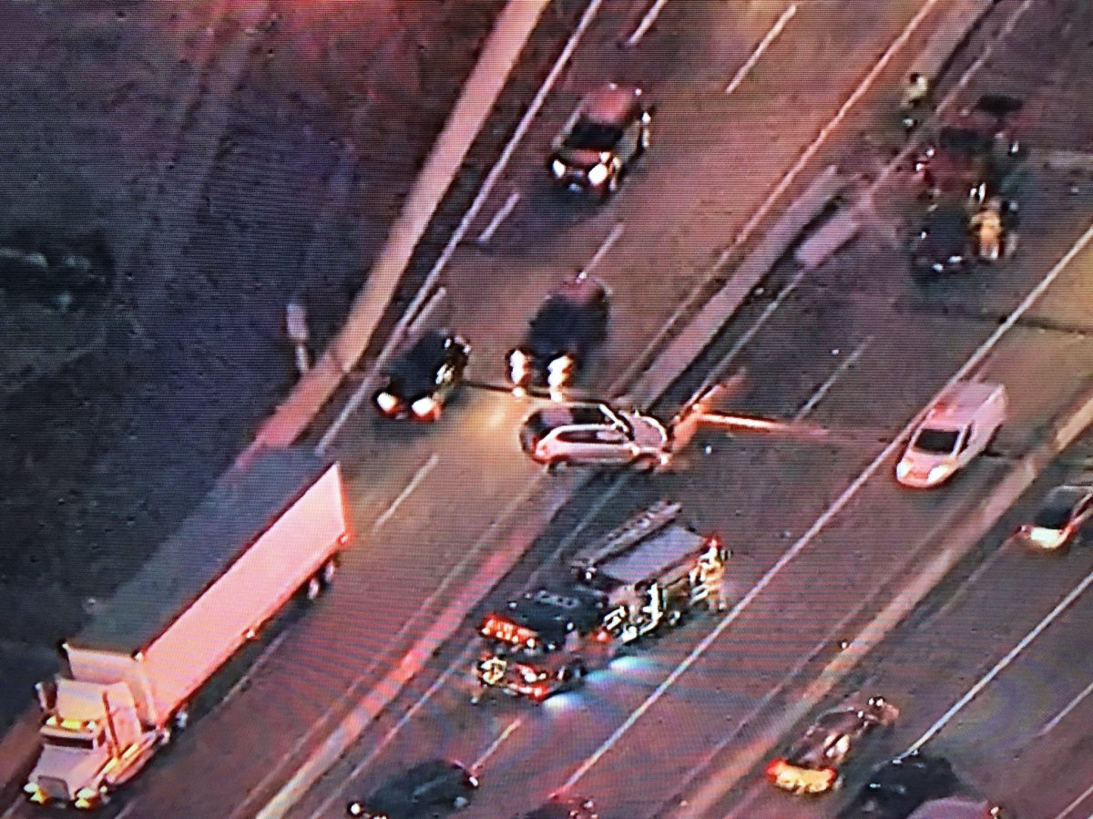 You can see the car on top of the concrete barrier in this aerial photo.