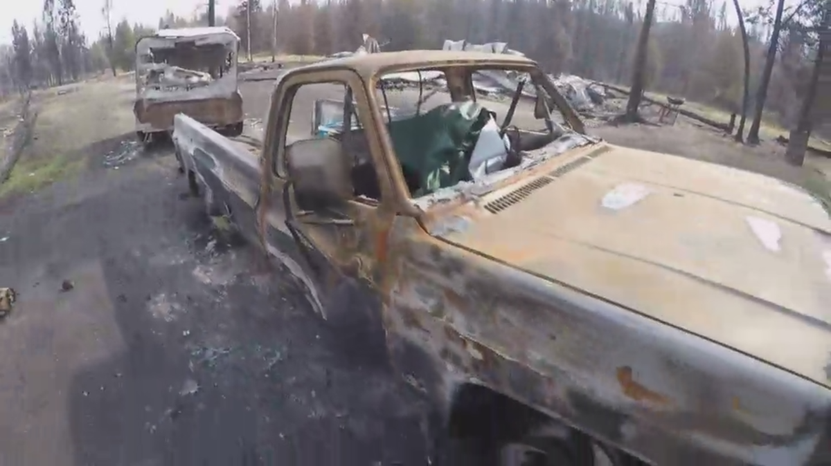 The charred remains of a truck in Pressy Lake, a community that was ravaged by the flames of the Elephant Hill wildfire.