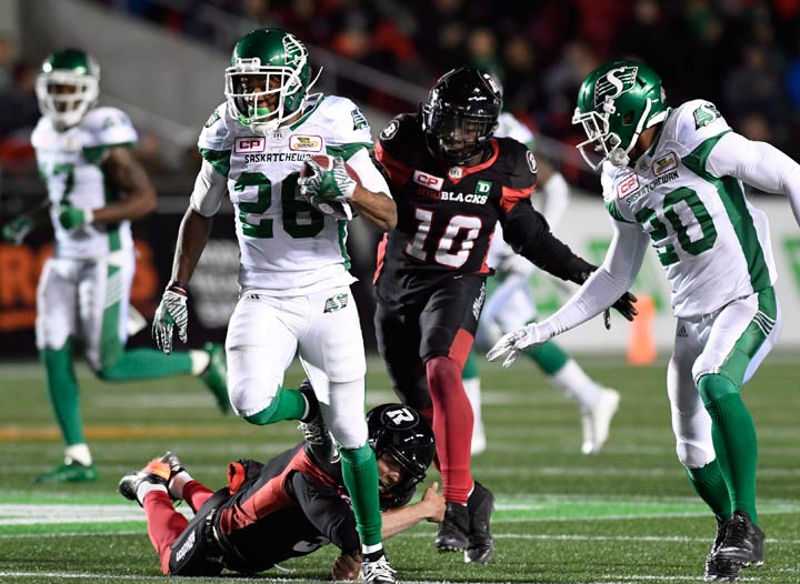Saskatchewan Roughriders running back Christion Jones (26) runs past the Ottawa Redblacks to score a touchdown during second half CFL football action in Ottawa on Friday, Sept. 29, 2017. THE CANADIAN PRESS/Justin Tang