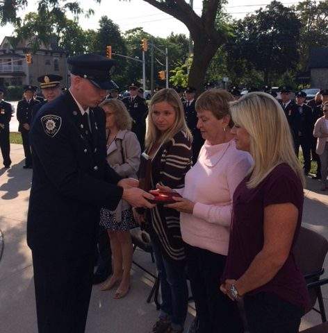 President of the LPFFA Jason Timlick presents the Martin E. Pierce medal to Jean Varey (middle) and Krista Smith (right).
