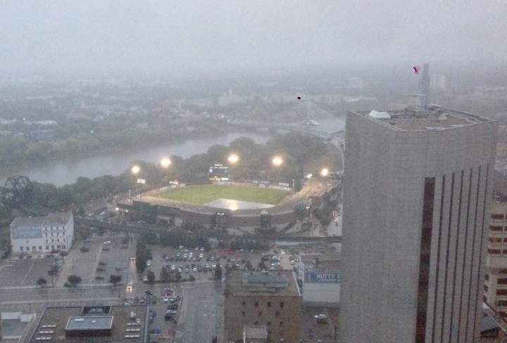 A tarp covers the diamond at Shaw Park on Saturday after the third game of the American Association championship series was rained out.