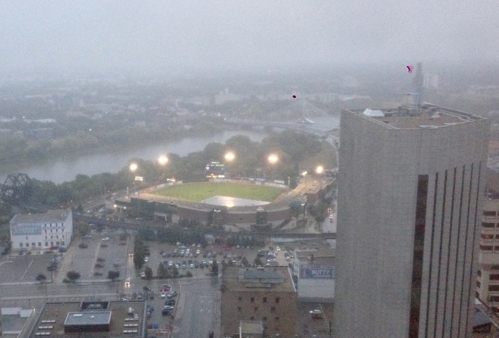 A tarp covers the diamond at Shaw Park on Saturday evening to protect it from rain.