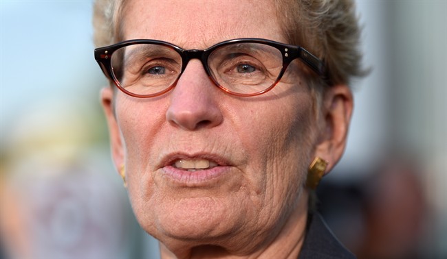 Ontario Premier Kathleen Wynne talks to media after appearing as a witness in the Election Act bribery trial in Sudbury, Ontario, Wednesday, Sept. 13, 2017. 