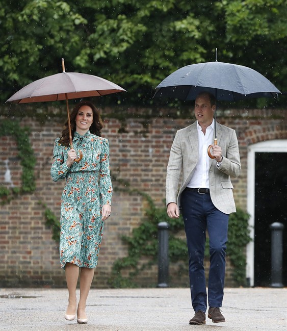 In this Wednesday, Aug. 30, 2017 file photo Britain’s Prince William and his wife Kate, Duchess of Cambridge smile as they arrive at the memorial garden in Kensington Palace, London.