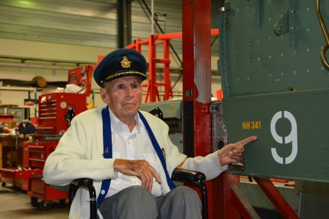Tommy Wheler visits the restoration of a spitfire plane from his old WWII squadron.