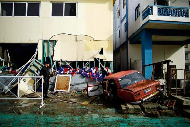 A vehicle lies embedded in the shattered Anti Imperialist Tribune building, after it was flung there by the force of Hurricane Irma, just a few meters from the United States Embassy building , in Havana, Cuba, Sunday, Sept. 10 2017. Powerful waves and storm surge from Hurricane Irma topped Havana's iconic Malecon seawall and left thousands of homes, businesses and hotels swamped, even as the storm moved away from the island.