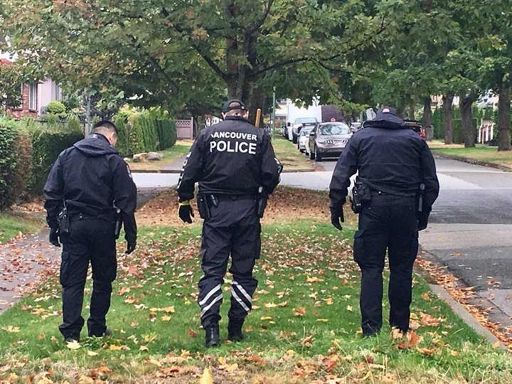 Vancouver police on the scene, searching for evidence.