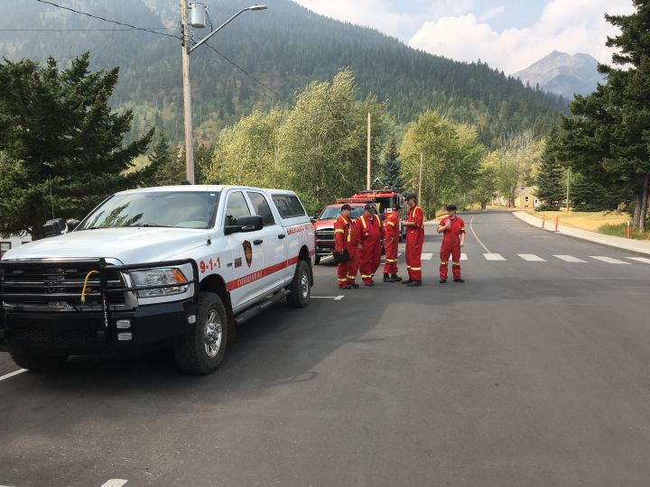 Fire crews work to prevent wildfire from spreading through Waterton ...