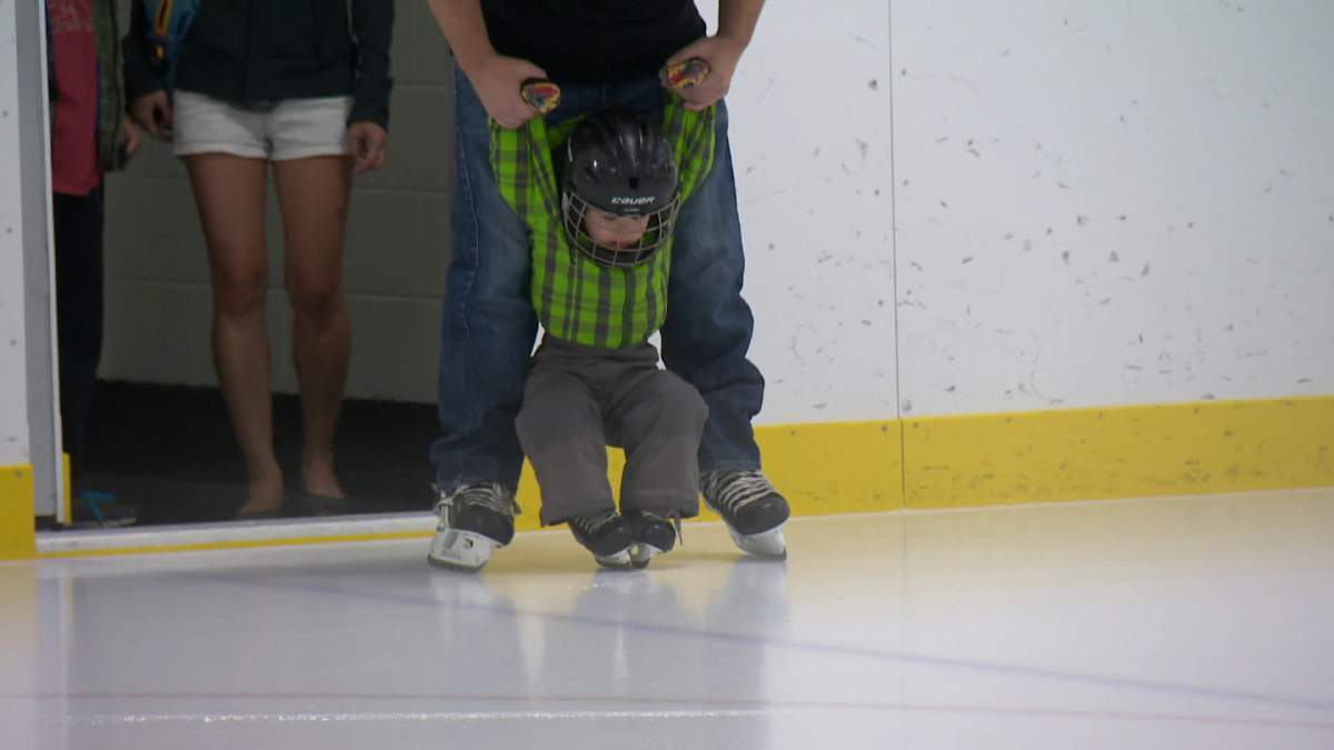 A young skater tests out the renovated rink at the West Hillhurst Arena at the grand reopening celebration Saturday. 