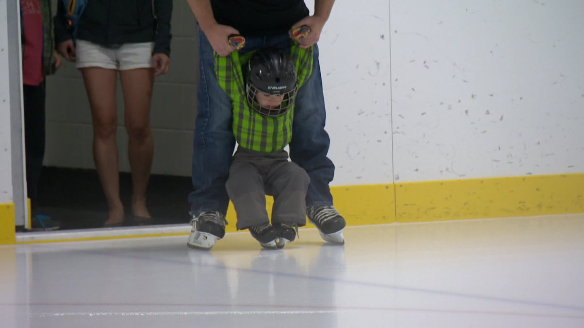 A young skater tests out the renovated rink at the West Hillhurst Arena at the grand reopening celebration Saturday. 