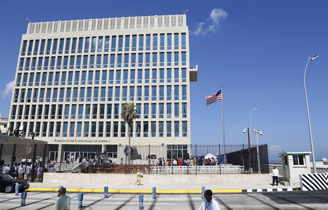 In this Aug. 14, 2015, file photo, a U.S. flag flies at the U.S. embassy in Havana, Cuba. U.S. investigators are chasing many theories about what‚ harming American diplomats in Cuba, including a sonic attack, electromagnetic weapon or flawed spying device.