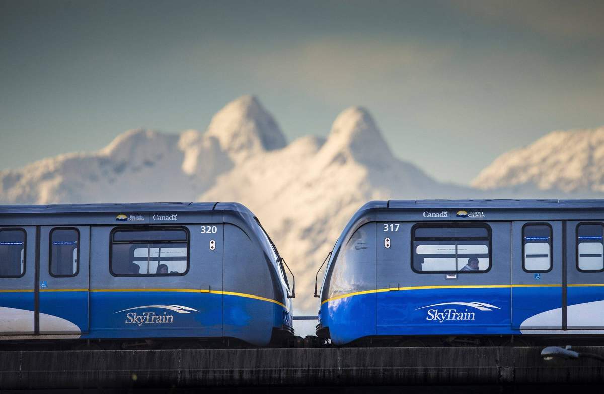 A Millennium Line Skytrain is seen in Burnaby, B.C. with the North Shore Mountains in the distance on Jan. 13, 2013.