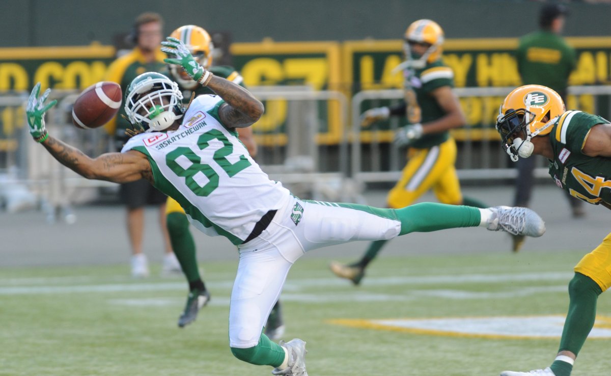 Saskatchewan Roughriders player #82 (WR) Naaman Roosevelt tries to reach for the ball during the 1st quarter of CFL game action between the Edmonton Eskimo's and the Saskatchewan Roughriders at the Brick Field located at Commonwealth stadium in Edmonton Friday, August 25/2017. Riders won the game 54-31. (CFL PHOTO Walter Tychnowicz- ).