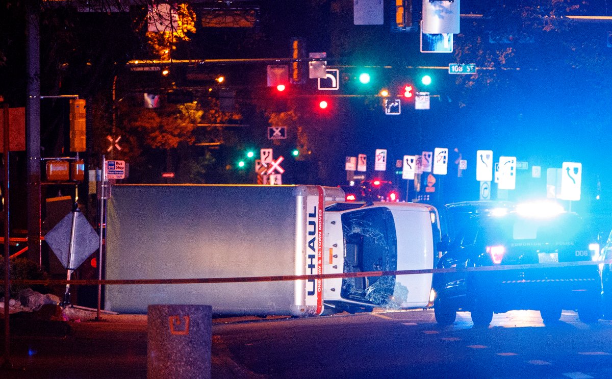 A U-Haul truck rests on its side after a high-speed chase with police in Edmonton Alta, on Saturday Sept. 30, 2017. Police say the U-Haul intentionally swerved at pedestrians at crosswalks throughout the chase.