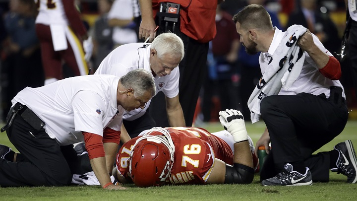Kansas City Chiefs offensive lineman Laurent Duvernay-Tardif (76) is tended to by trainers during the first half of an NFL football game against the Washington Redskins in Kansas City, Mo., Monday, Oct. 2, 2017.