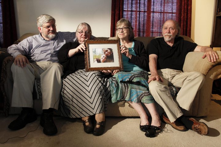 In this June 4, 2014, file photo, from left, Patrick Boyle, Linda Boyle, Lyn Coleman and Jim Coleman hold photo of their kidnapped children, Joshua Boyle and Caitlan Coleman, who were kidnapped by the Taliban in late 2012.