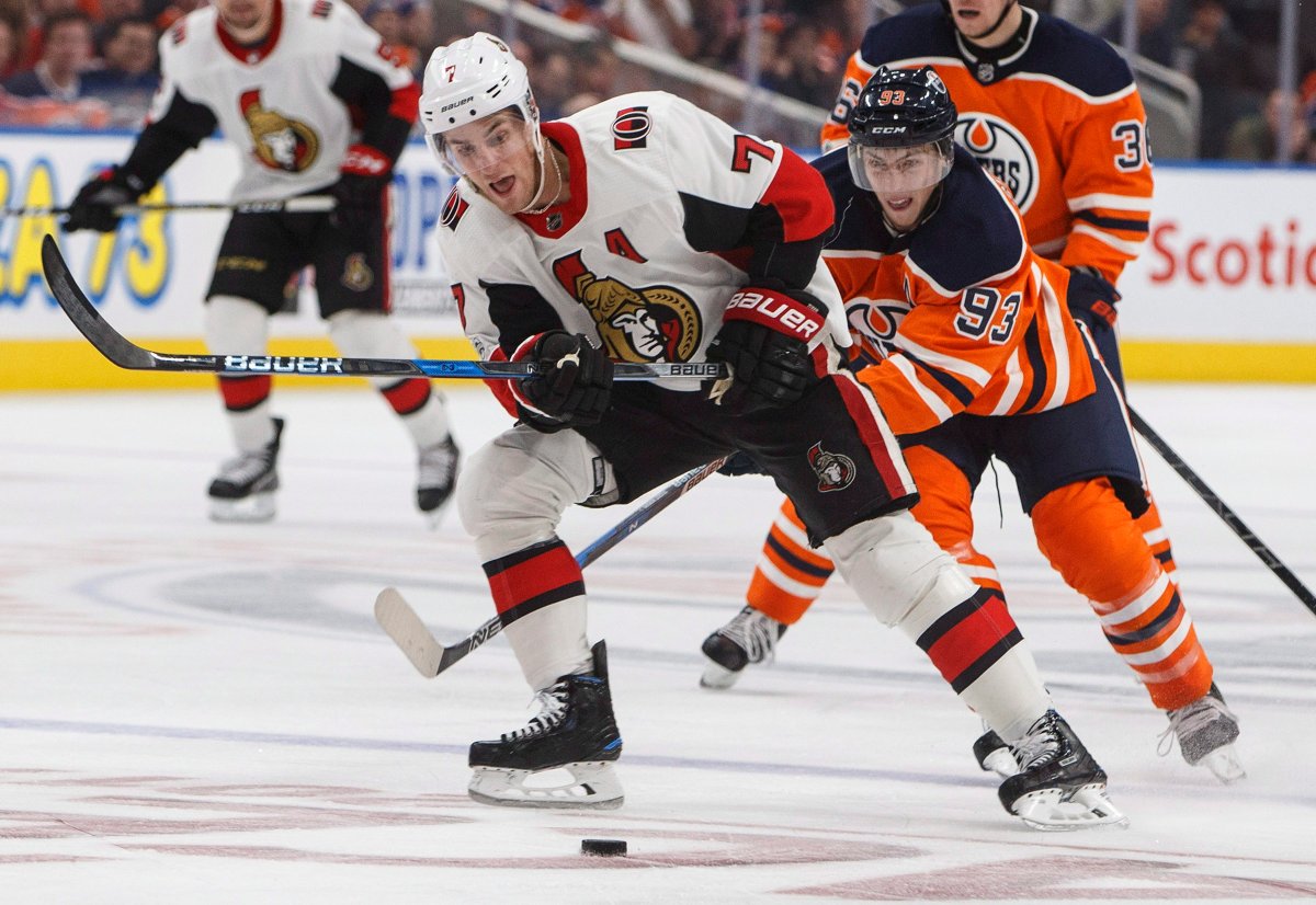 Ottawa Senators' Kyle Turris (7) is chased by Edmonton Oilers' Ryan Nugent-Hopkins (93) during third period NHL action in Edmonton on Saturday, October 14, 2017. THE CANADIAN PRESS/Jason Franson.