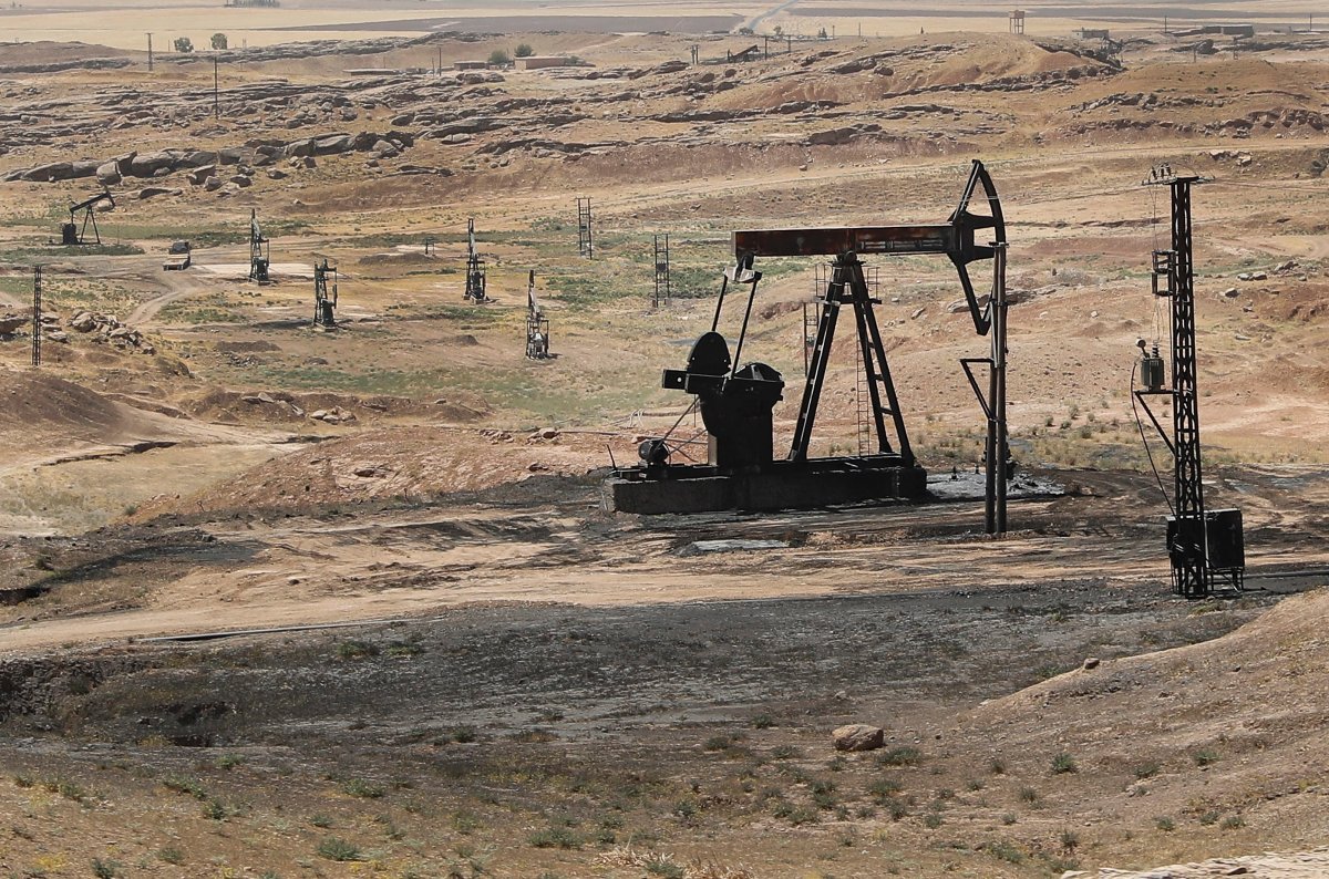 This July 30, 2017 photo, shows an oil field controlled by the Kurdish-led Syrian Democratic Forces (SDF), in Rmeilan, Hassakeh province, northeast Syria. 